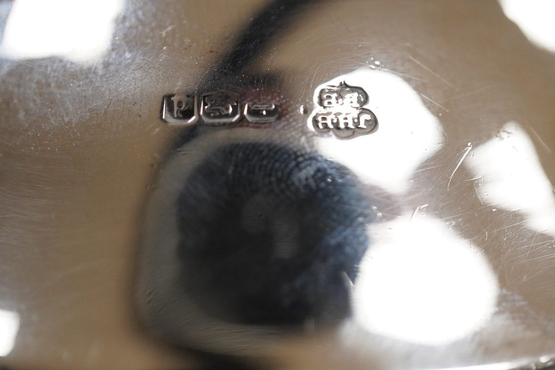 A George V silver pedestal bon bon dish, Sheffield, 1921, diameter 13.2cm, one other earlier silver dish by Josiah Williams & Co, London, 1904 and a silver cigarette case. and a cigarette case, gross 11.5oz.